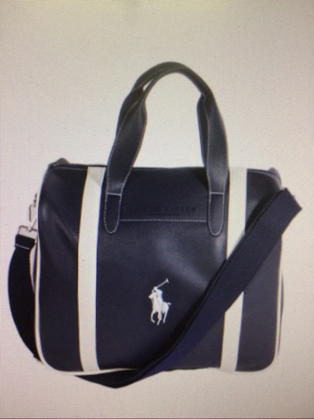 Dark blue PU leather handbag for short trips.